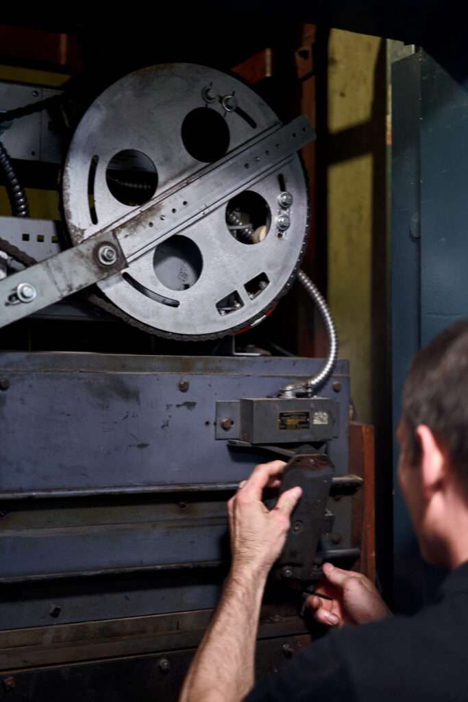 ICON Elevator technician carefully adjust elevator door